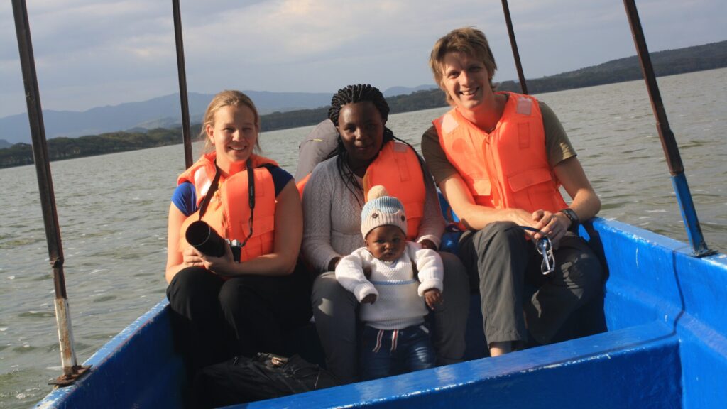 Guided boat cruise on a Lake Naivasha day trip from Nairobi passing wild hippos near Crescent Island Sanctuary